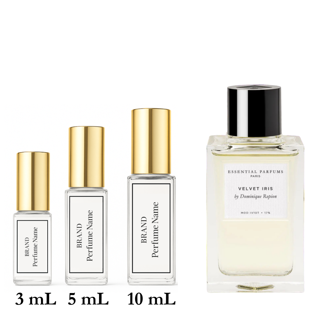 Set of four perfume bottles with different sizes on a white background