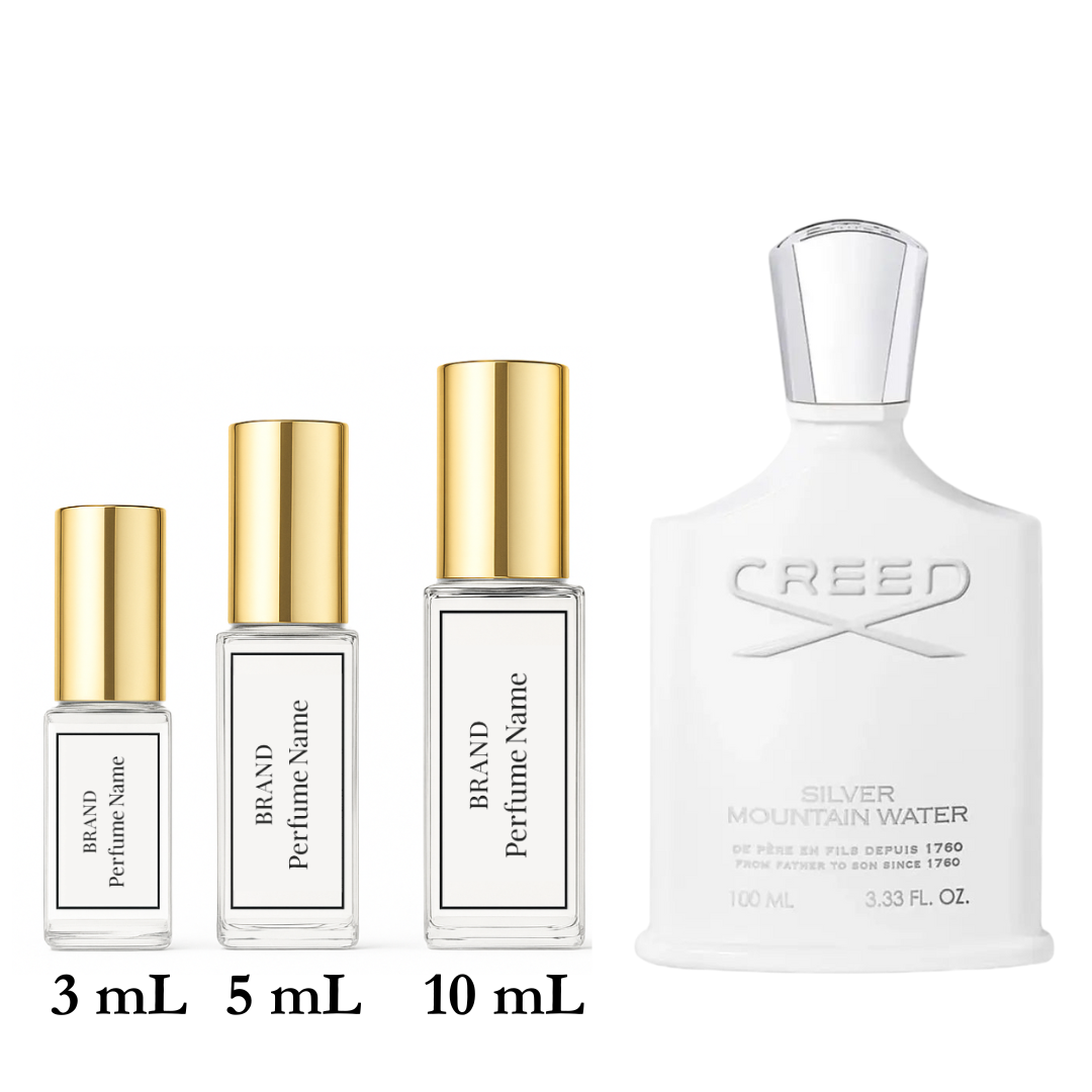 Collection of Creed perfume bottles and smaller sample containers on a white background