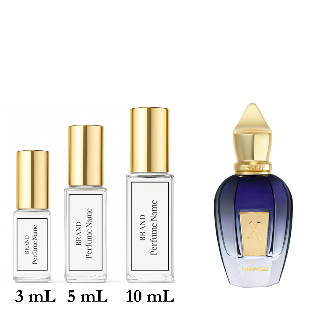 Set of four perfume bottles with varying sizes on a white background
