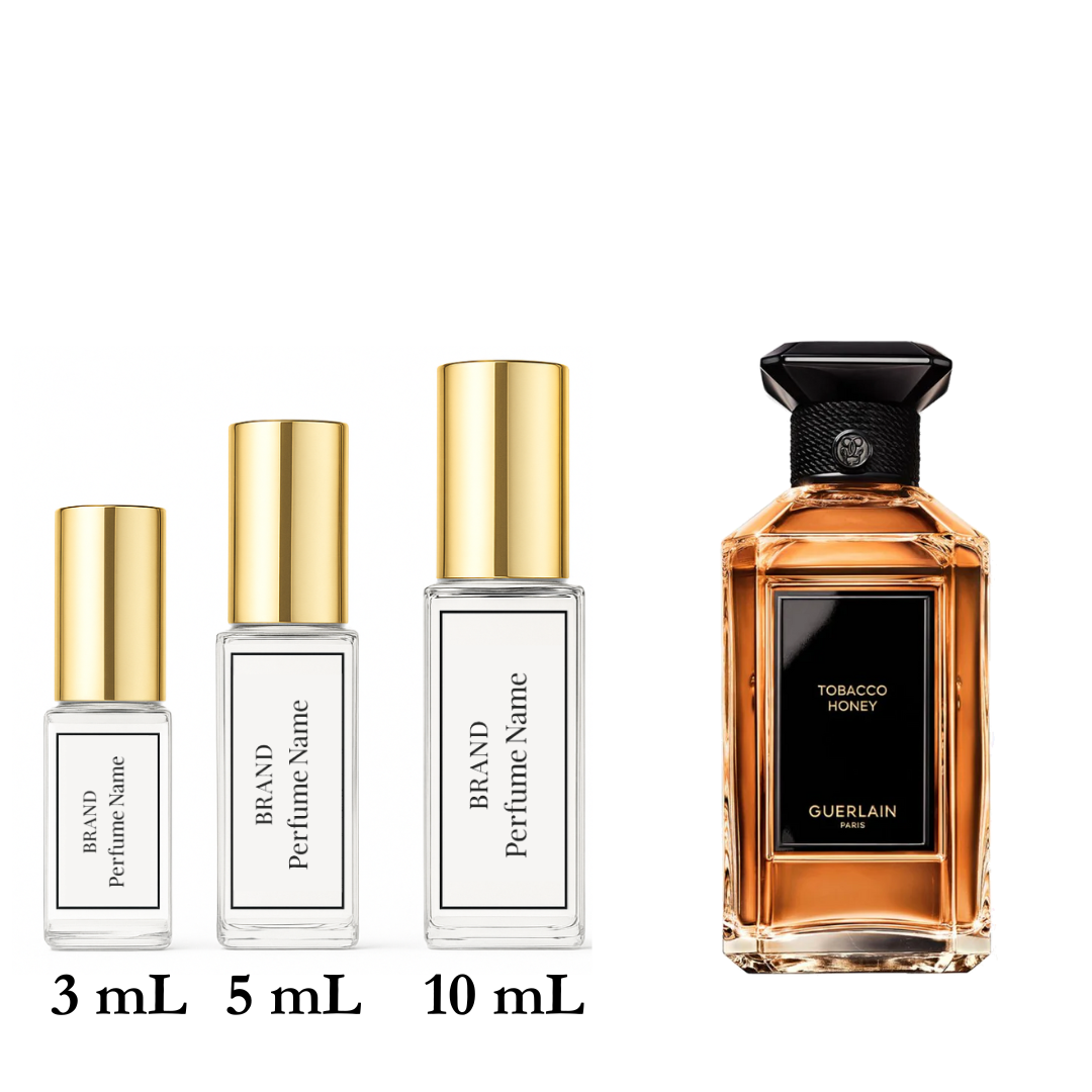 Collection of perfume bottles with different sizes on a white background