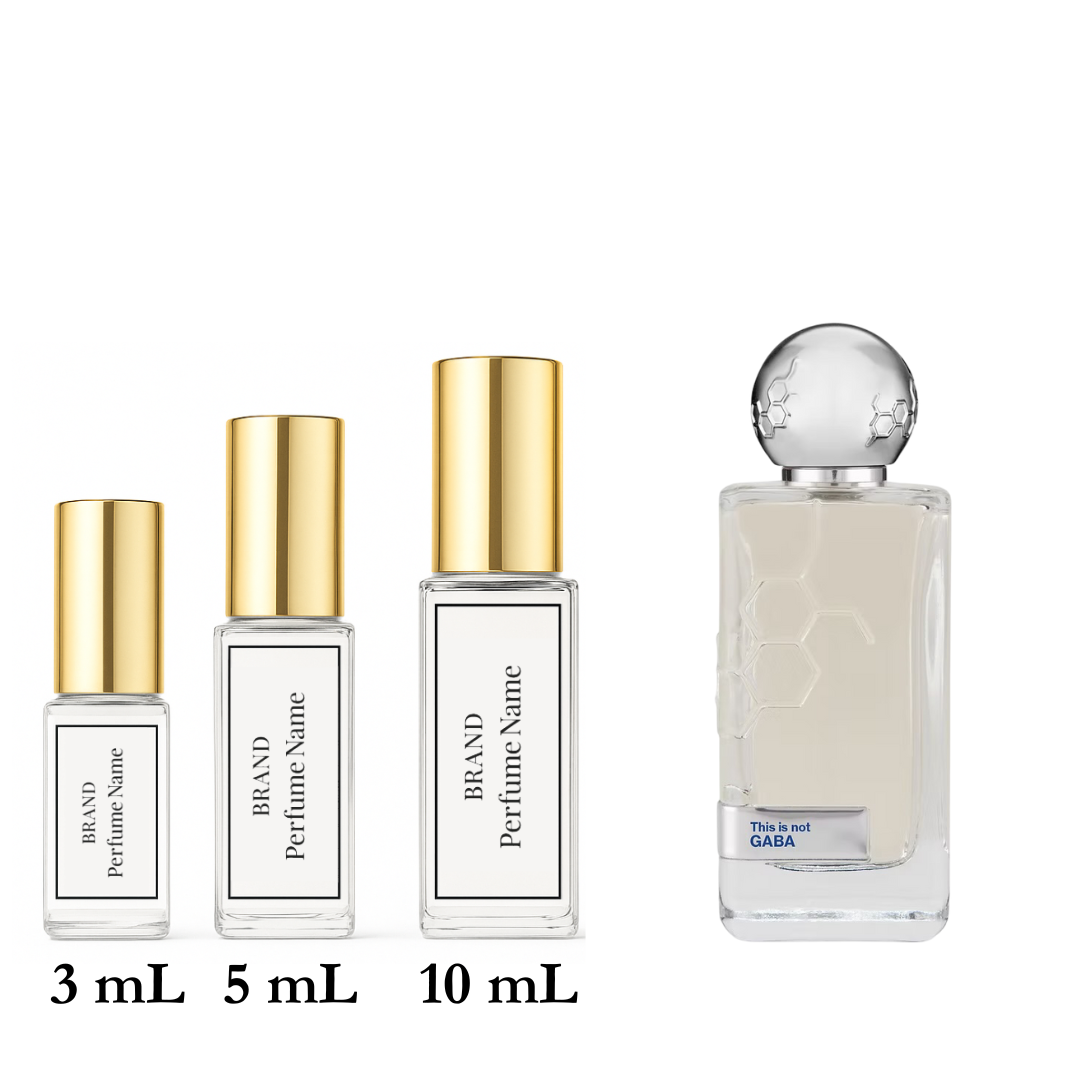 Set of four perfume bottles with different sizes on a white background