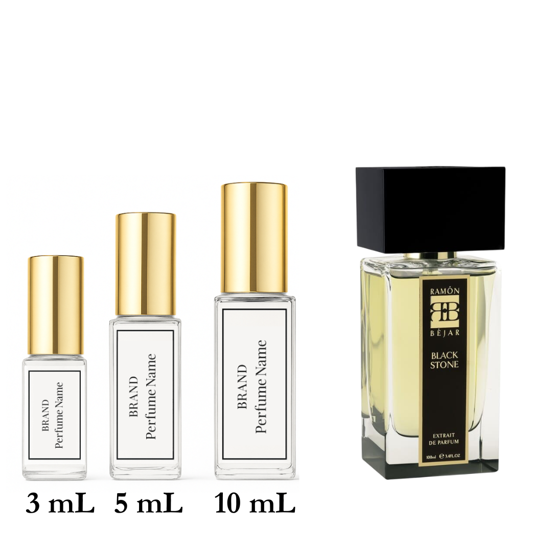 Set of four perfume bottles with varying sizes on a white background