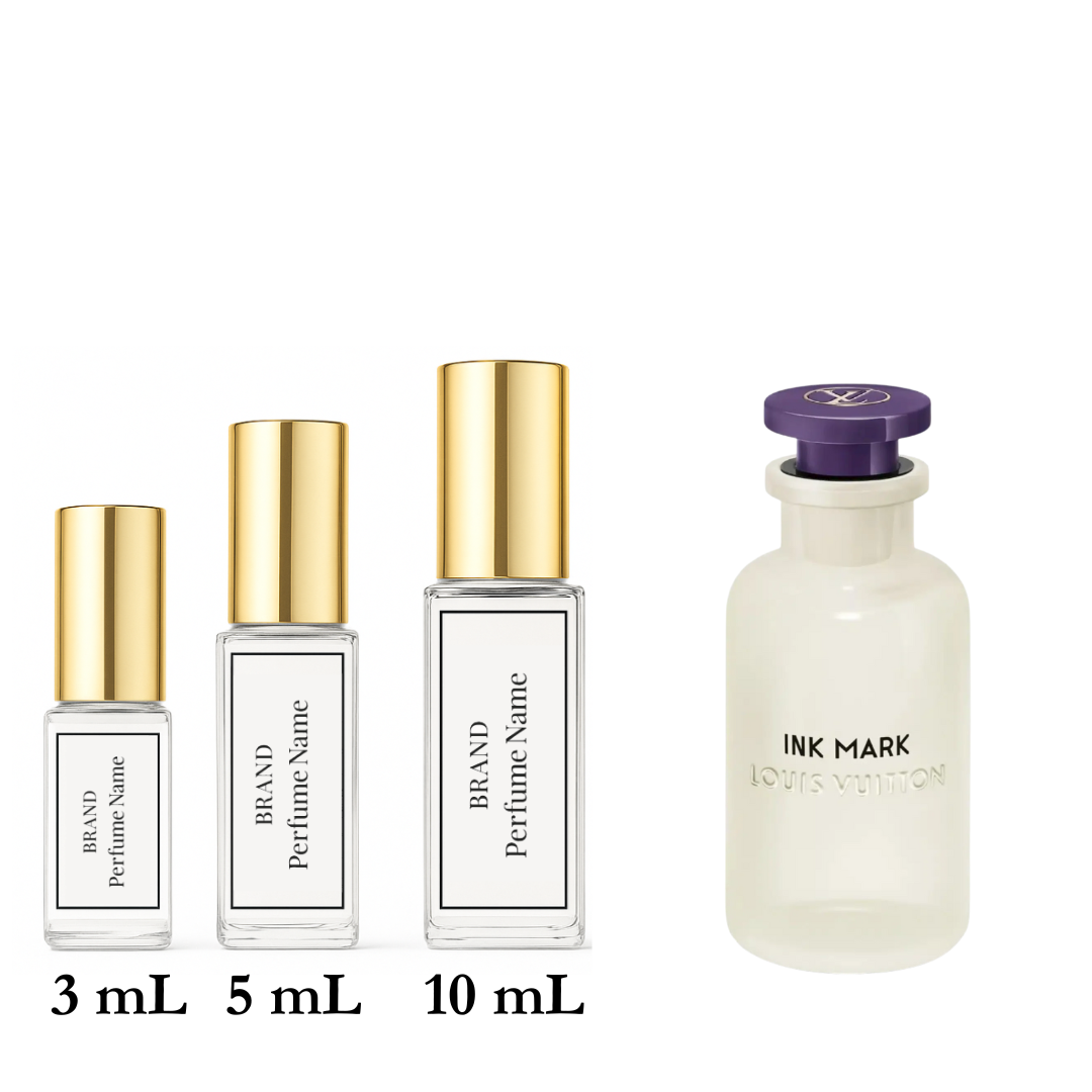 Set of four perfume bottles with different sizes on a white background
