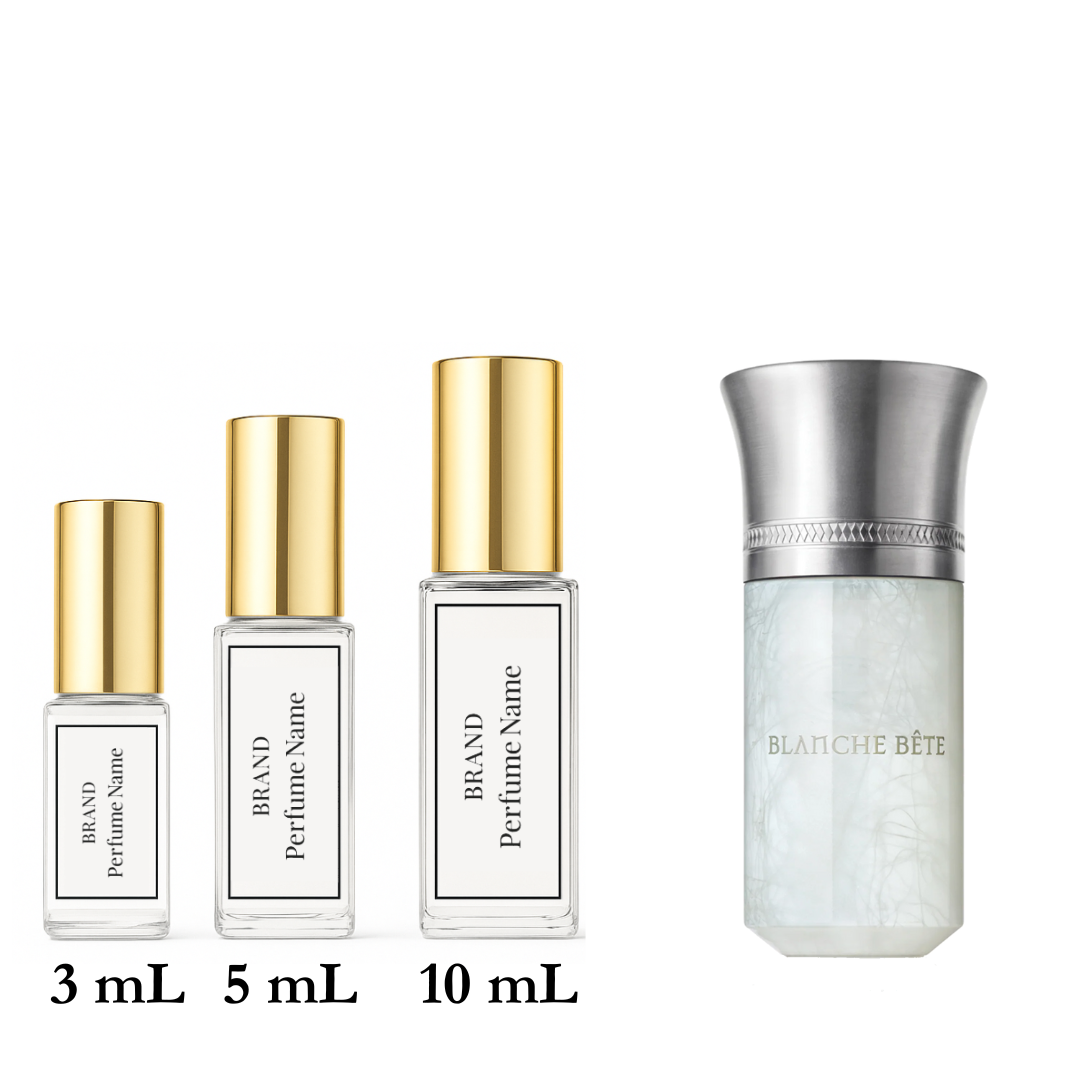 Set of four perfume bottles with different sizes on a white background
